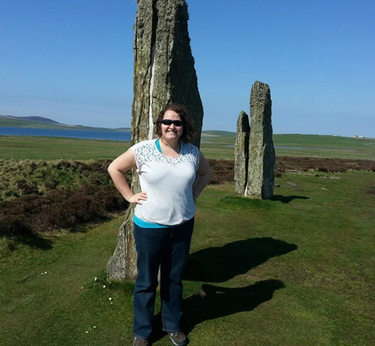 Marisa at the standing stones of stenness in Orkney, Scotland